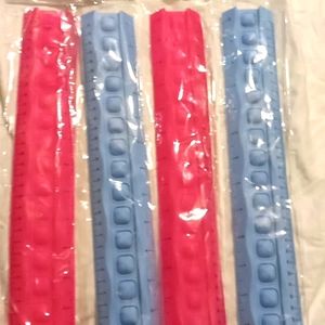 4 pop it sensory rulers